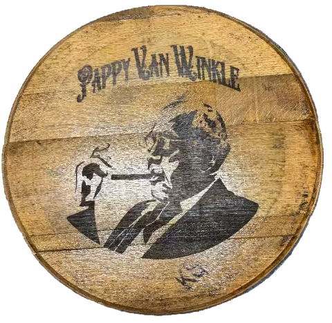Wooden barrel head with 'Pappy Van Winkle' branding on a blue surface
